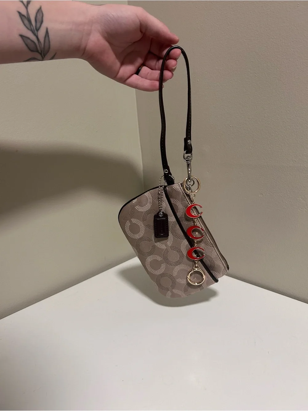 Coach Taupe Signature Canvas Wristlet with Red Charm Accents